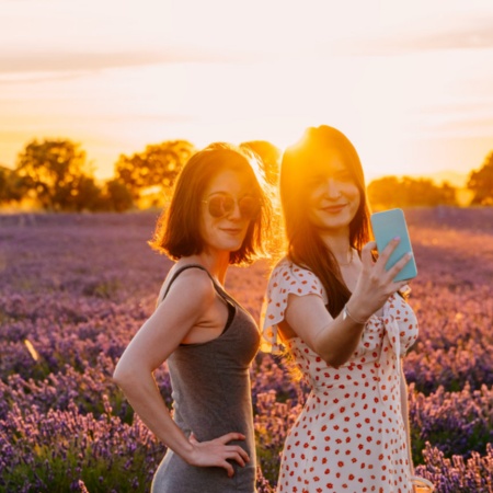 Couple posing in a lavender field during sunset