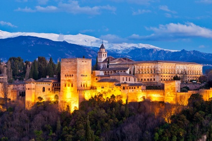 General view of the Alhambra at dawn, in Granada (Andalusia)