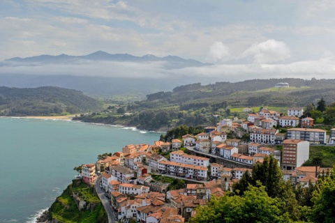 View of Lastres with the sea and Los Picos de Europa mountains in the background. Asturias