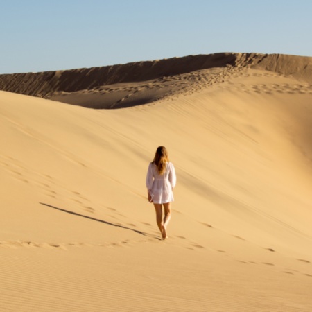 Tourist in the Maspalomas Dunes Special Nature Reserve in Gran Canaria, Canary Islands