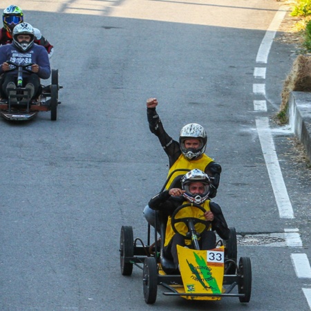 Several competitors reaching the finishing line in the Grand Prix de Carrilanas in Esteiro, A Coruña