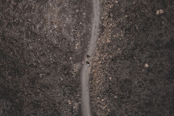 An aerial view of two hikers in the park