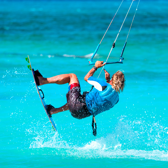 Man doing a kitesurfing stunt