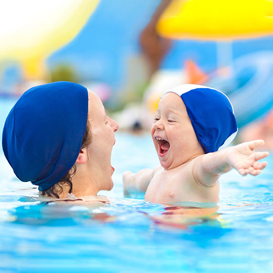 Family enjoying themselves in the children’s swimming pool