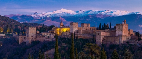 Views of the Alhambra with the Sierra Nevada mountain range in the background during the winter in Granada, Andalusia