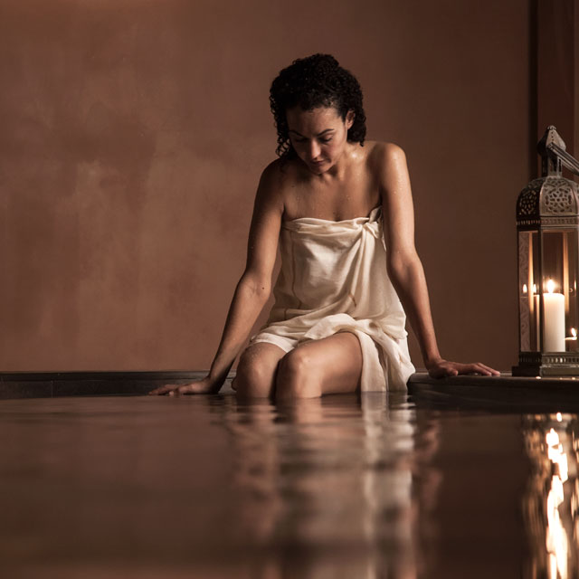 A woman relaxing in the Arab baths